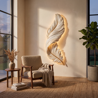 Lumiere Feather Wall Sconce in living room at dusk