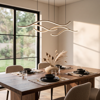 Onda Curved Pendant Light above a dining table