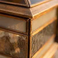 Macro detail of the solid copper corner post and glass panel joint on the Rame pillar light