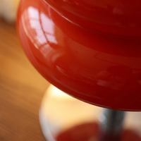 Macro detail of the high gloss curved glass surface of the Bellona table lamp
